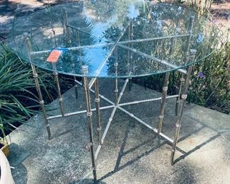 $250 
Round metal bamboo table 36"Diam glass top&nbsp;