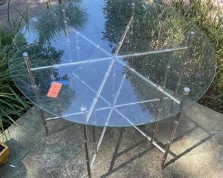 $250 
Round metal bamboo table 36"Diam glass top&nbsp;