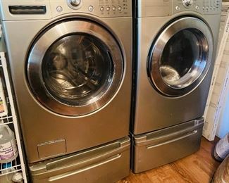 $450 
LG Tromm washer & dryer on risers&nbsp;