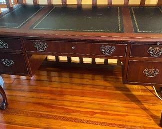 $395 
National Mount Airy desk with leather top 56Lx28Tx30H