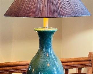 $95 
Green pottery lamp on desk&nbsp;