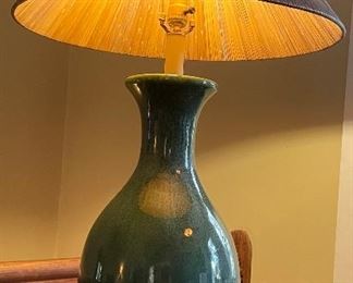 $95 
Green pottery lamp on desk&nbsp;
