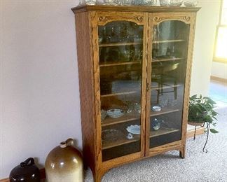 Nice flat-front china cabinet. Crock jugs. Cut glass. Pressed glass.