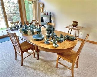 Antique oak dining table. 4 leaves and 4 chairs.