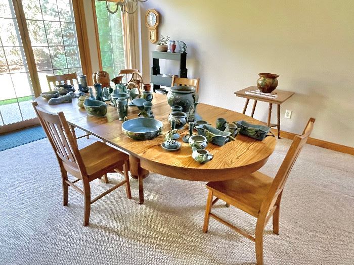 Antique oak dining table. 4 leaves and 4 chairs.