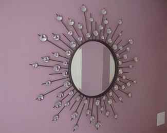 Bevelled mirror in starburst frame