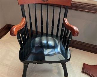 Black Nebraska Seal Captains Chair with Cherry Crown and Cherry Arm Rests