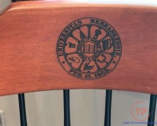 Black Nebraska Seal Captains Chair with Cherry Crown and Cherry Arm Rests