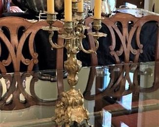 One of two silverplate candelabras 