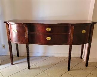 Mahogany Sideboard in the Hepplewhite style with reeded inlayed in tapered legs and inlay Bell Flower design.  By Thomasville 66"×24"×37. Provenance an embassy in Washington DC. 