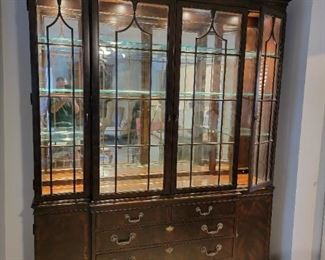 Drexel Heritage Lighted Breakfront. Complete with a three-tone lighting system.  Mahogany veneers and oak secondary wood.  A two-part form for easy moving. 6'x8'x26".