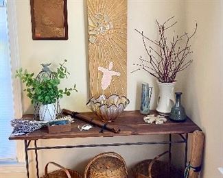 Rustic iron and wood console table filled with fun decor  & antique baskets. Large one of a kind Andy Lakey art piece with inlaid mirror.