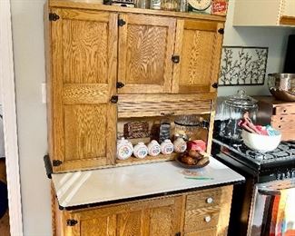 Amazing antique hoosier cabinet with original til flour shoot and glass jar.