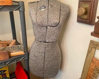 vintage dress form on adjustable stand.