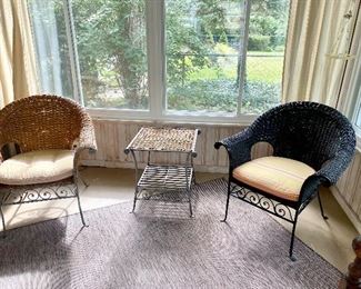 Wicker and wrought iron table and chairs. 