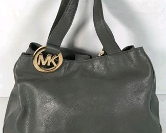 Michael Kors women's Gray leather snap inner pocket shoulder handbag size large nice shape outside few small pen marks inside $50 
Bin#19
