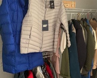 Large volume of ladies clothing.  Size large and XL.  Many with tags attached.  Coats above are Talbots, Lands End, London Fog and more.