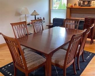 Lexington cherry dining table, includes (6) chairs, (2) leaves, and table pads 