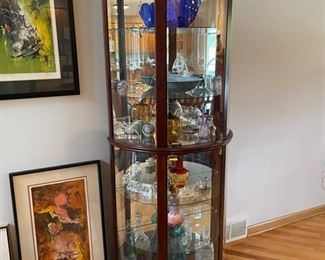 Lighter curio cabinet with glassware and collectibles 