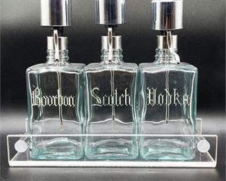 Lot 181
Vintage Liquor Pump Decanters in Lucite Caddy