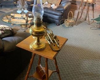 1 of 2 matching oak tables, oil lamp, vintage trumpet