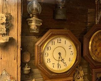 Ornately carved original Waterbury clock, oil lamps