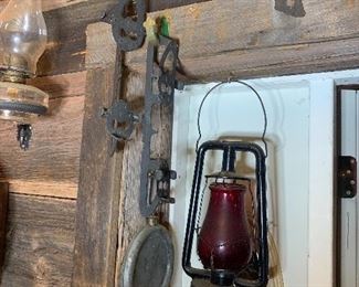 Antique ice skates, hanging oil lamp