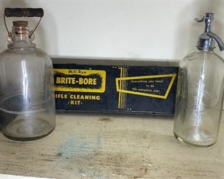 Seltzer bottle on right is pre 1920 Faygo which at that time was Feigenson Brothers Bottling Works