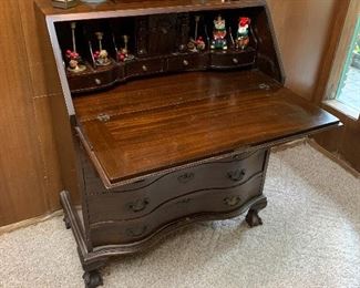 Antique secretary, candle sticks, Christmas ornaments 