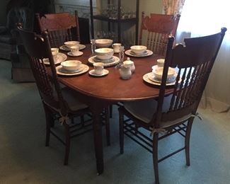 Beautiful antique, drop leaf dining table and chairs.