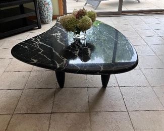 Item #4.                                                                                                 Black and white marble table.                                                      60" length x 40" width x 16" height
$300