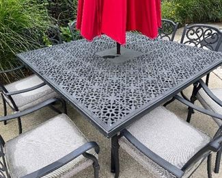 Item 9.                                                                                                    
Black outdoor table with red umbrella, and 8 chairs with pads                                  
65" length x 65" width x 29 1/2" height

$800