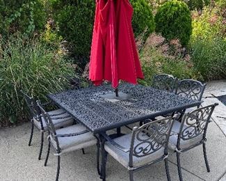 Item 9.                                                                                                     Black outdoor table with red umbrella, and 8 chairs with pads                                  
65" length x 65" width x 29 1/2" height

$800
