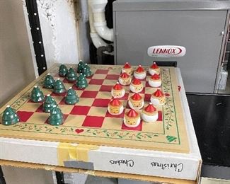 Wooden checker board game with Christmas tree and Santa pieces
