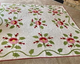 …Beautiful Vintage Red and Green Floral Appliqué Quilt, turkey red & Poison green.  Hand Quilted, a few discolorations, binding worn, heavily quilted.  Measures: 84” x 86” (002). Hand Appliquéd could use new binding but beautiful nonetheless!