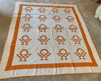 ….Vintage Hand Quilted Basket Quilt.  Few small stains, wear on the border and binding.   78 1/2” x 65” (014)