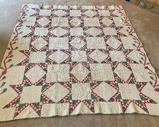 …Hand Quilted Antique Quilt.  The red fabric has some shredding, beautiful dense heavy quilting.  Binding shows some wear, few small stains.  Measures: 82 1/2” x 72” (015)
