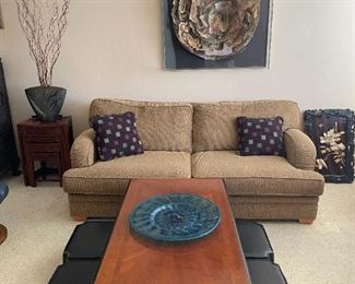 Twill two cushion sofa, coffee table, Japanese low benches and a mixed media floral collage.