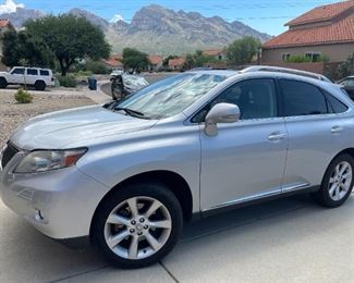 $14,000. Silver 2010 Lexus RX 350 sport utility four-door SUV v-6 3.5 liter auto six speed with overdrive and fwd, 6-CD player, radio, bluetooth, navigation, leather seats w. heating and cooling, moonroof, all the bells and whistles. Dealer serviced, 149k miles.