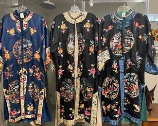 Three vintage silk robes are among several vintage gowns from the 60s