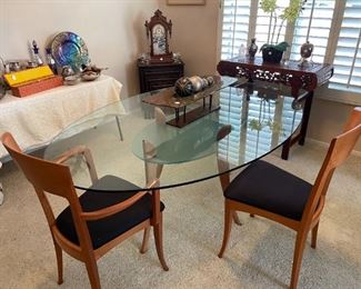 contemporary glass top dining table with four chairs