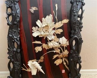 Carved ebony, mahogany and floral carvings.