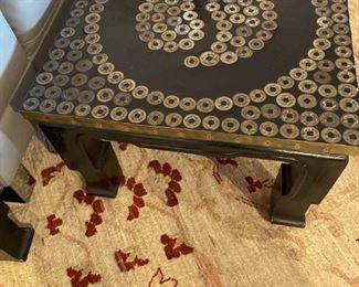 Pair of Yin Yang tables adorned with Chinese coins.