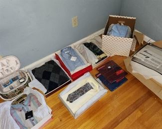 new clothing, blankets & towels, just unwrapped from gift paper