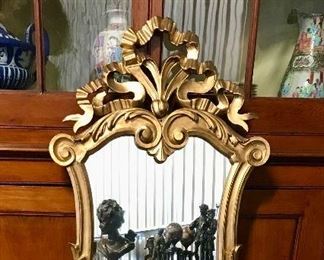 1 of pair
Pair 19th c carved giltwood mirrors, ribbon top with masks 
23” x 46”
SOLD