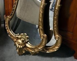 Pair 19th c carved giltwood mirrors, ribbon top with masks 
23” x 46”
SOLD