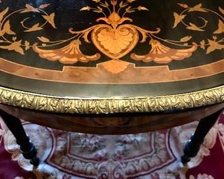 Detail
Victorian style 
marquetry library table
musical & bird motif
ormolu mounts & edge
made in Italy, 20th c
55.25” x 30.5” x 30.5”
$1600
