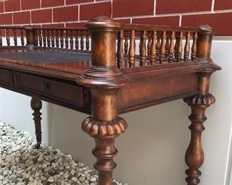 Detail
Plunkett 
desk with gallery & turned legs
burl wood & leather top insert
turned legs and brass casters
57” x 26” x 35” h
SOLD