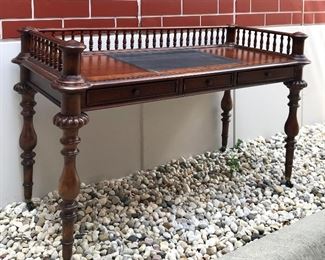 Plunkett 
desk with gallery & turned legs
burl wood & leather top insert
turned legs and brass casters
57” x 26” x 35” h
SOLD