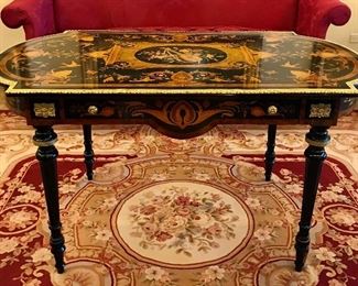 Victorian style 
marquetry library table
musical & bird motif
ormolu mounts & edge
made in Italy, 20th c
55.25” x 30.5” x 30.5”
$1600

Aubusson style carpet
crimson field with scrolls & foliage, creams & golds
late 20th c
94” x 126”
$1200